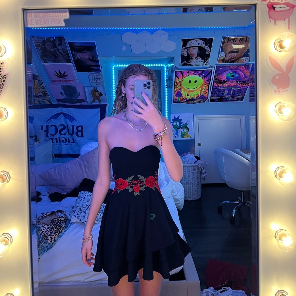 strapless black flowy dress with red flowers